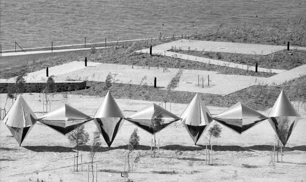 Black and white photo of seven alternating conical shapes