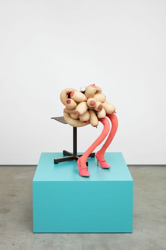 bronze, cast iron and concrete sculpture depicting abstract figure sitting on chair