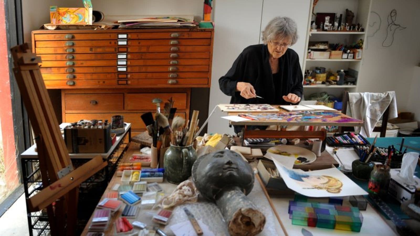 Photograph of woman in artist's studio