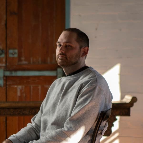 Portrait of a male sitting in a chair