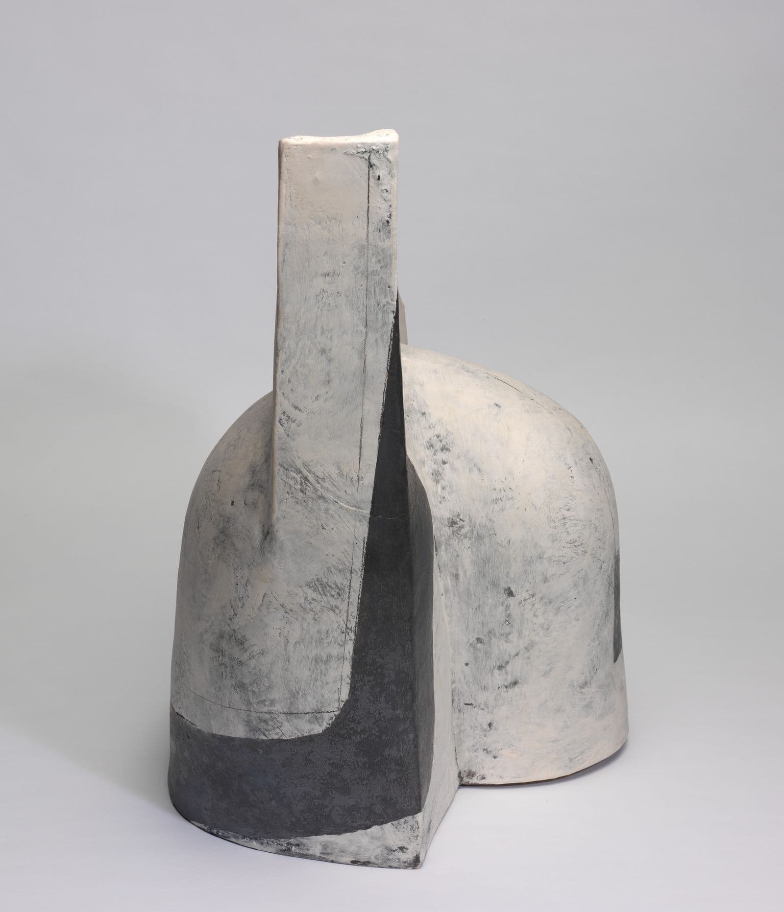 Abstract black and white sculpture with mottled texture