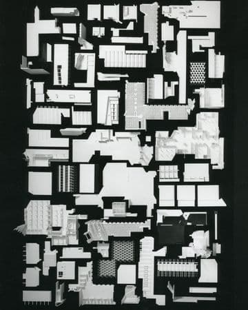 Black and white image of broken down architectural pieces. Archival photograph.