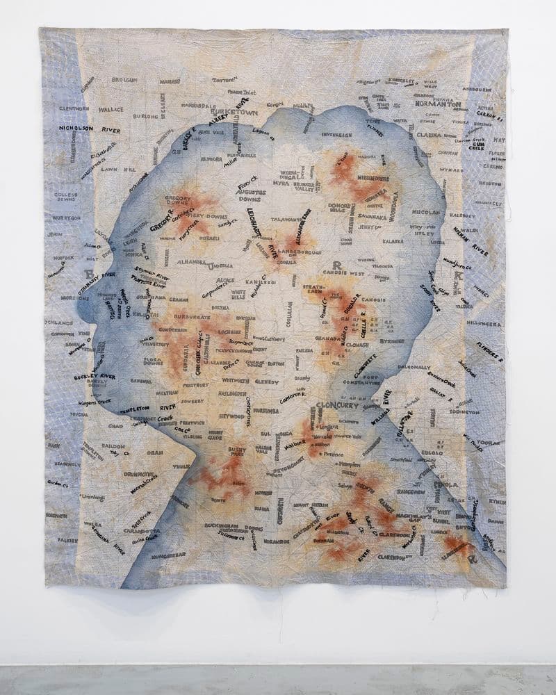 A work on paper, a map outline of Queensland with the outline of the profile of a woman's head overlayed