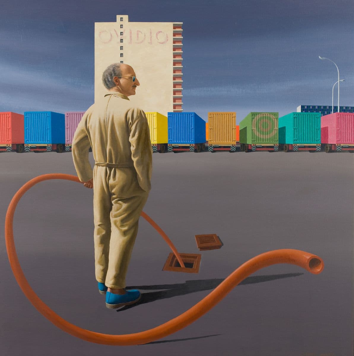 Painting of man wearing beige overalls, holding an open ended orange pipe into a square hold in the ground with colourful trucks in the background