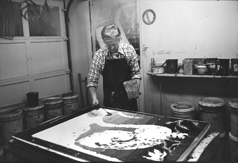 Robert Zakanitch using a spoon to apply paper pulp onto base sheet for 'Straightback swans I',