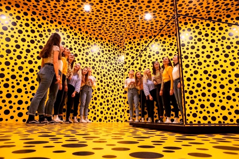 Photograph of group of young people in Kusama room