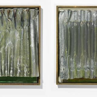 Four sculptures of corrugated steel sheets within rectangular timber frames hung side by side