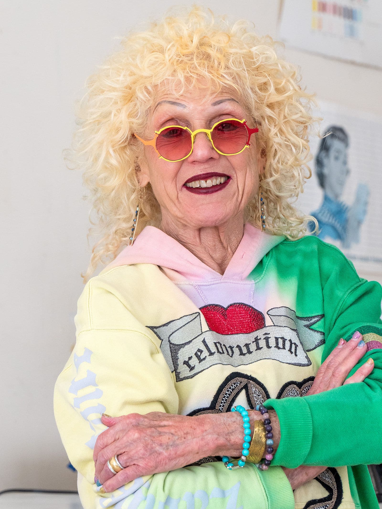 A colourful photo portrait of artist Judy Chicago