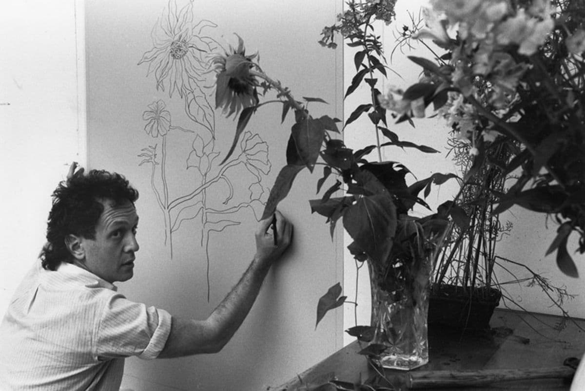 Photograph of Ed Baynard drawing on an aluminium plate for ‘The sunflower