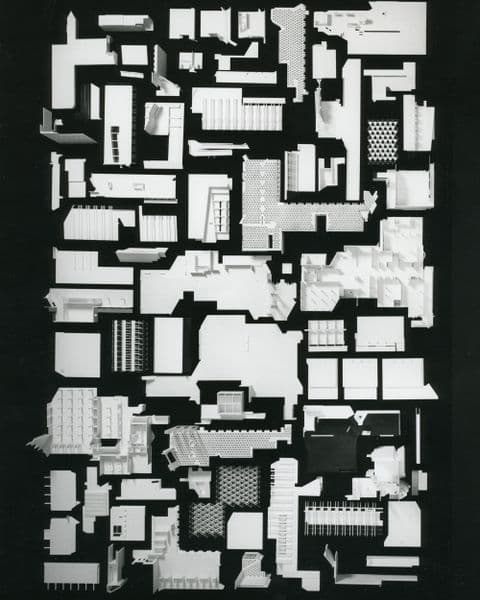 Black and white image of broken down architectural pieces. Archival photograph.