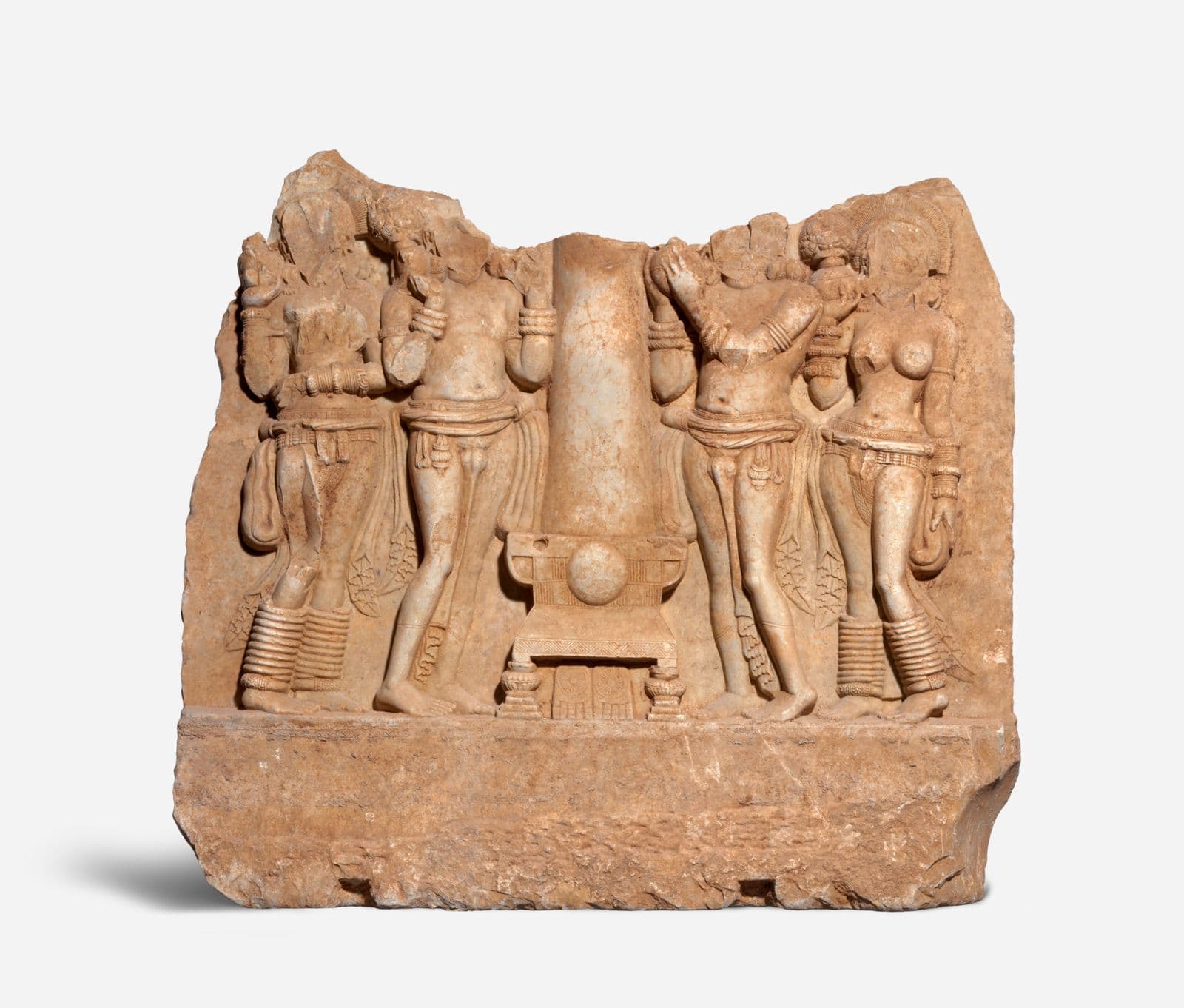 A limestone carved sculptured of people worshipping a diety
