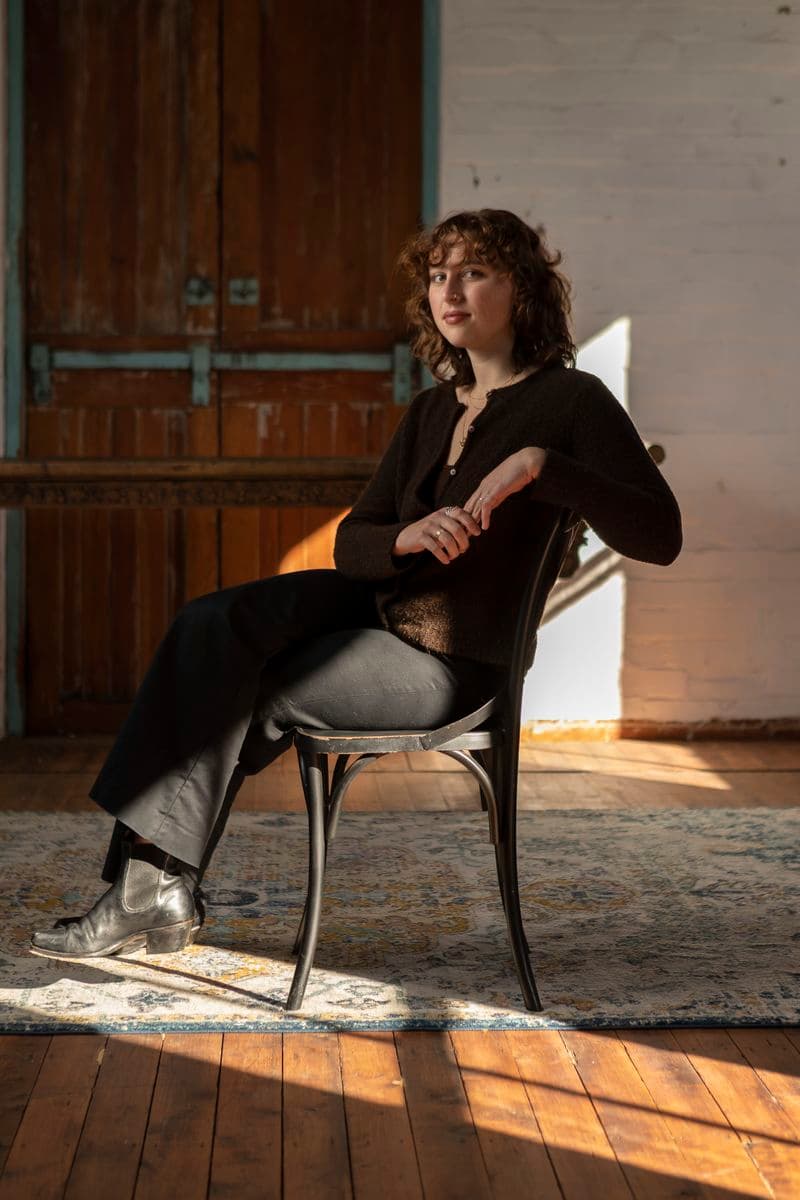 Portrait of a female sitting in a chair