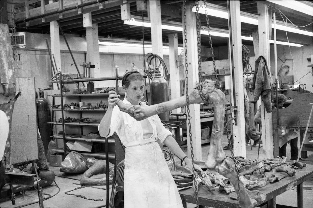 Nancy Graves inspects a bronze cast of a camel bone, thought to be for her work 'Ceridwen, out of fossils' at Tallix Foundry, 1977