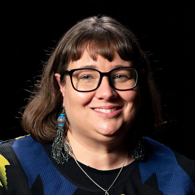 Portrait photograph of a woman smiling