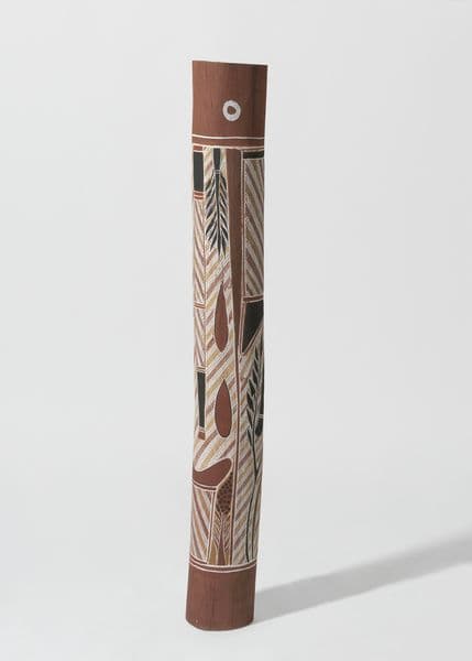 Traditional First Nations burial pole with ochre, black, white and yellow imagery of trees, birds, and diagonal striped patterning