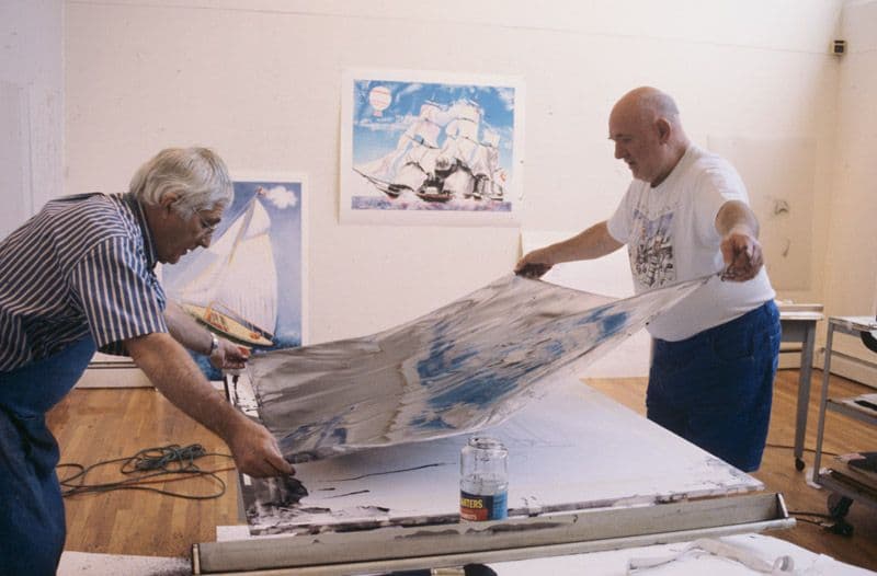 Photograph of Kenneth Tyler and Malcolm Morley inspecting lithographic tusche in preparation for blue colour separation for ‘Pamela running before the wind with a Dutch lighthouse