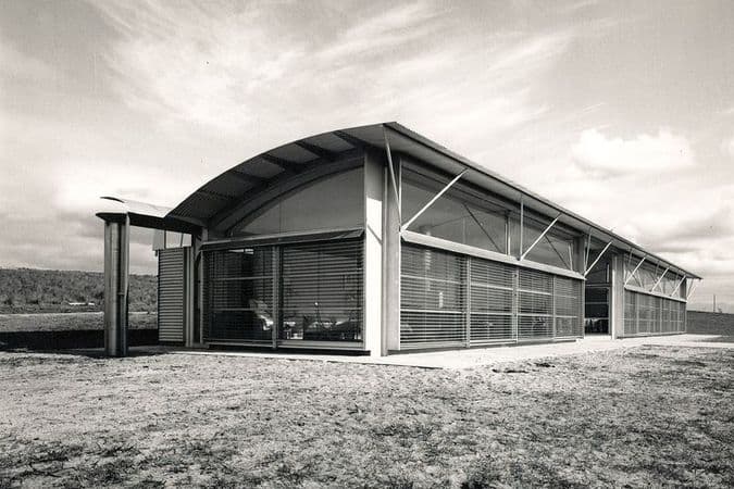 Black and white photograph of angular white building