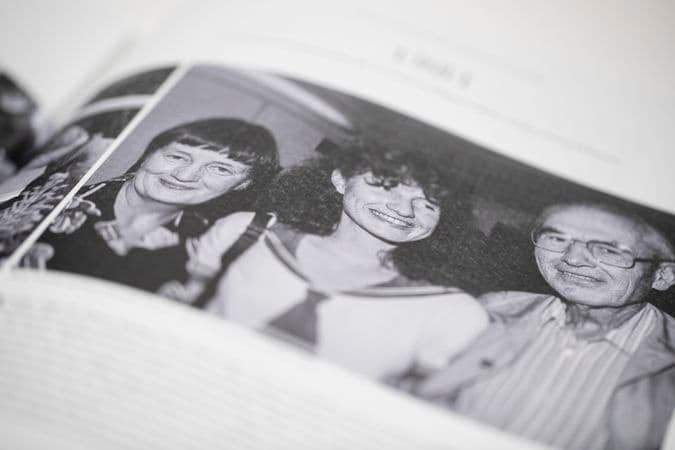 Close up colour photo of Cressida Campbell catalogue content, showing a photo of the young artist and her family