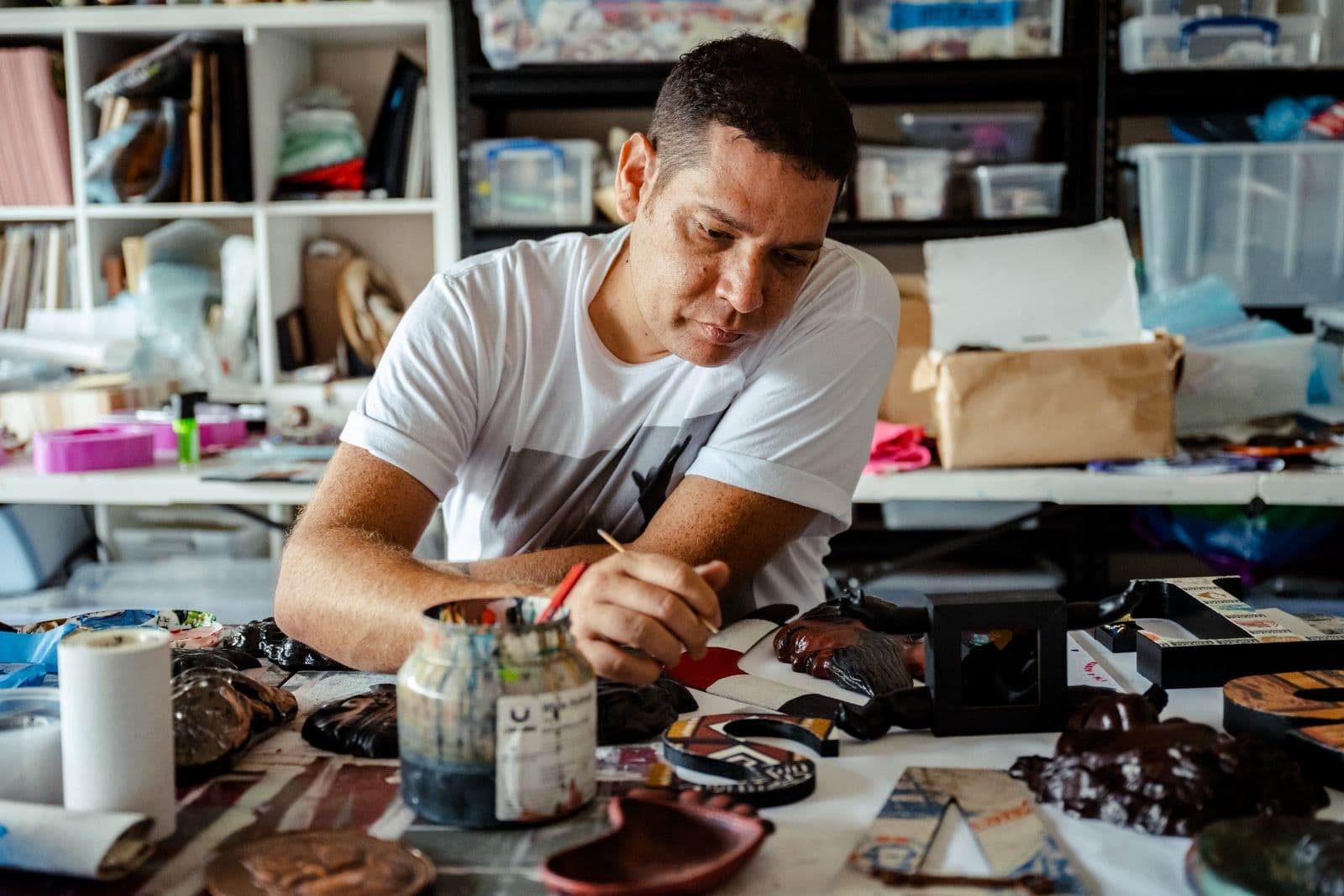 Tony Albert works in his studio.