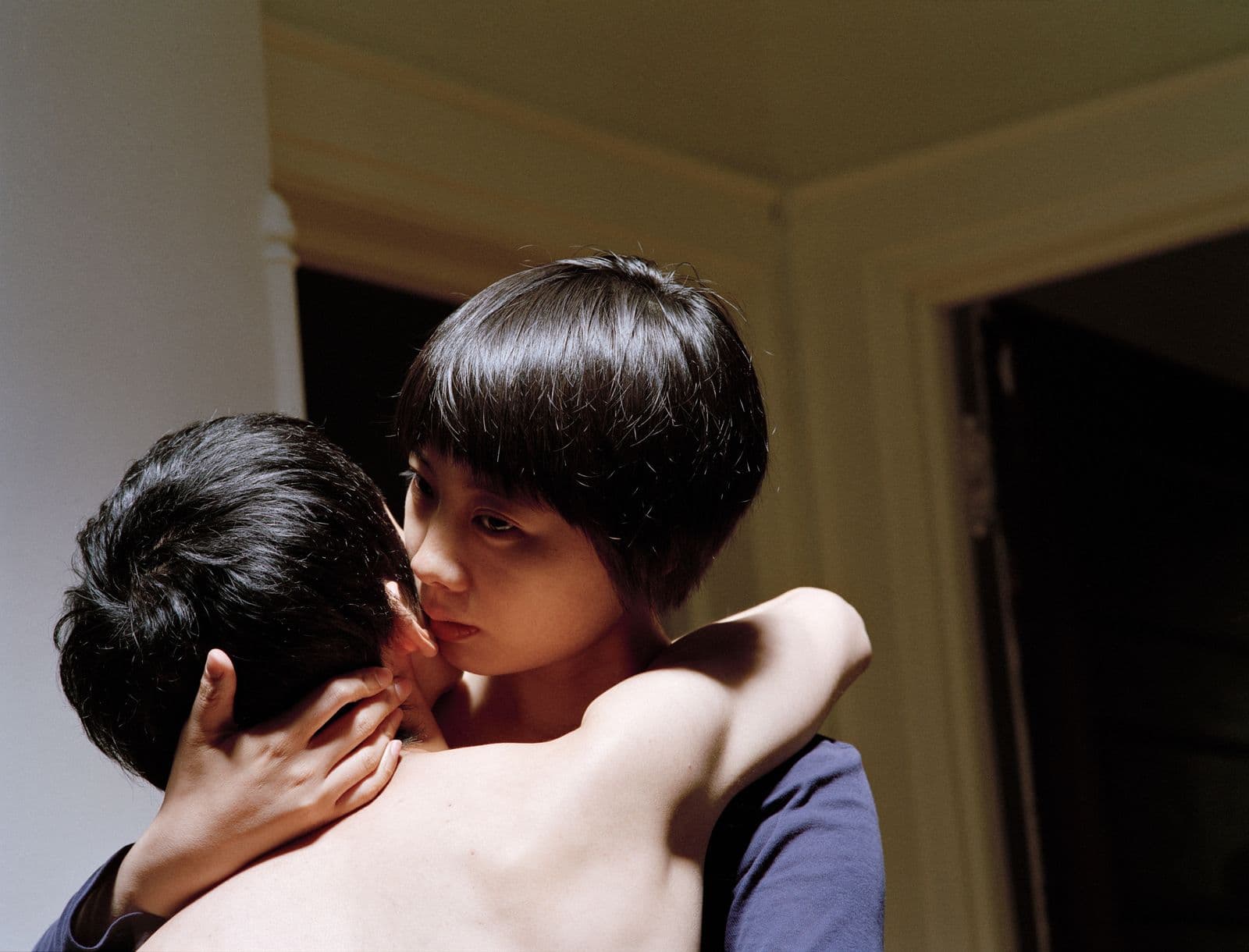 Photographic work of art of two people hugging close-up