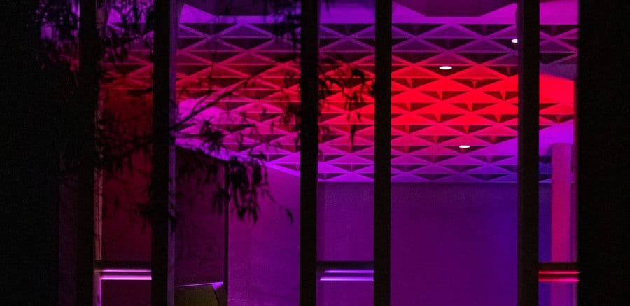 deep coloured building by night