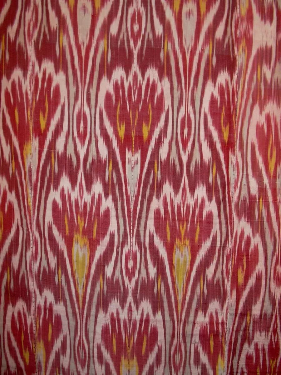 Red, white and yellow patterned silk wall hanging.