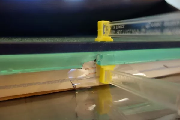 Tear in the polyurethane clamped while the adhesive cures